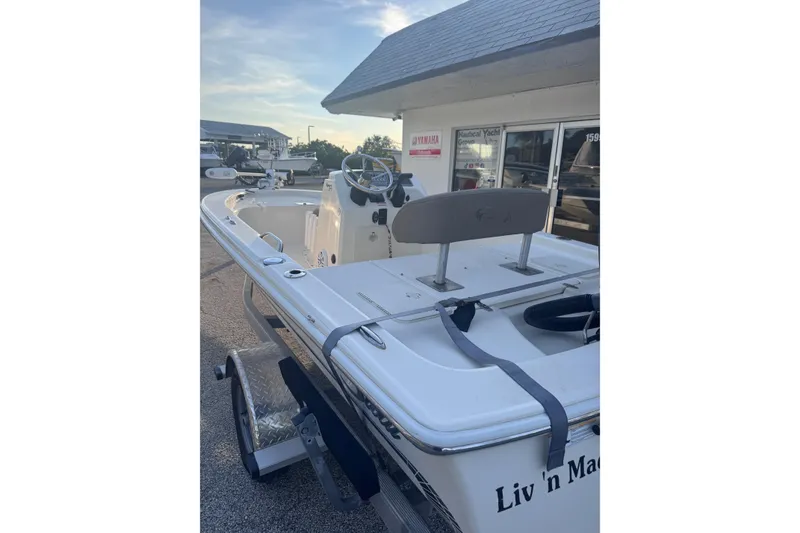 Slide: The Image of 2016 Scout 177 Sport boat on trailer outside a nautical shop. - 10