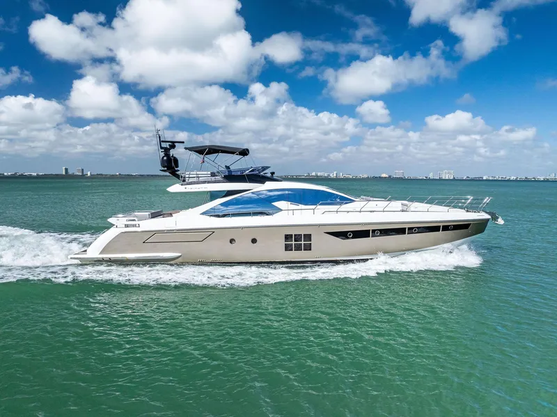 Slide: The Image of Azimut 77S 2017 yacht cruising on turquoise waters under a clear blue sky. - 1