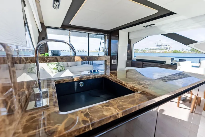 Slide: The Image of Luxurious kitchen interior of 2017 Azimut 77S yacht with marble countertops and modern design. - 15