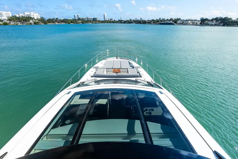 Slide: The Image of Azimut 77S 2017 yacht cruising on a serene blue waterway. - 2