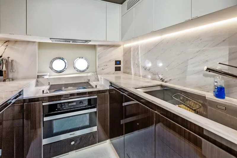 Slide: The Image of Luxurious kitchen interior of 2017 Azimut 77S yacht with modern appliances and marble finishes. - 21