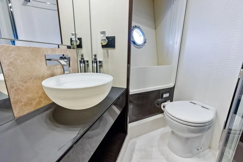Slide: The Image of Luxury bathroom in 2017 Azimut 77S yacht with modern sink and toilet. - 29