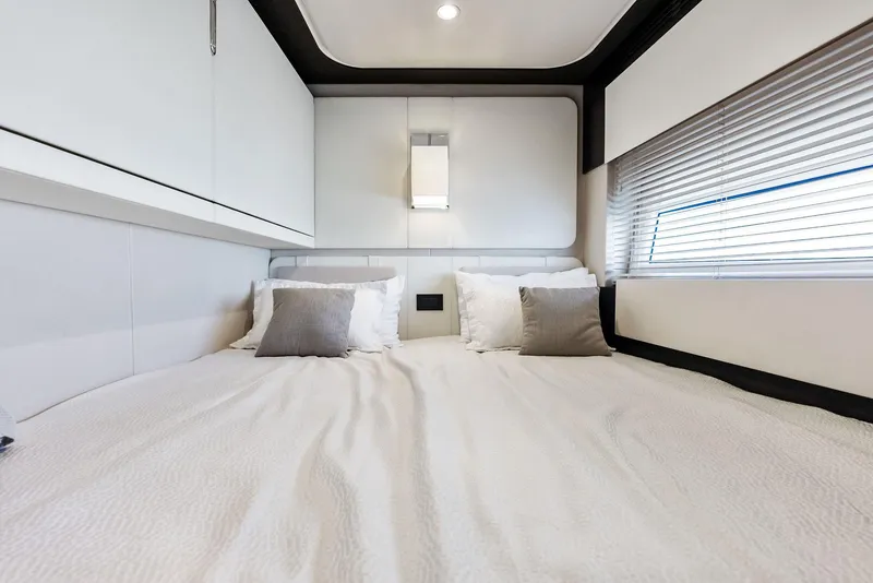Slide: The Image of Luxurious bedroom interior of 2017 Azimut 77S yacht with modern design and cozy bedding. - 32
