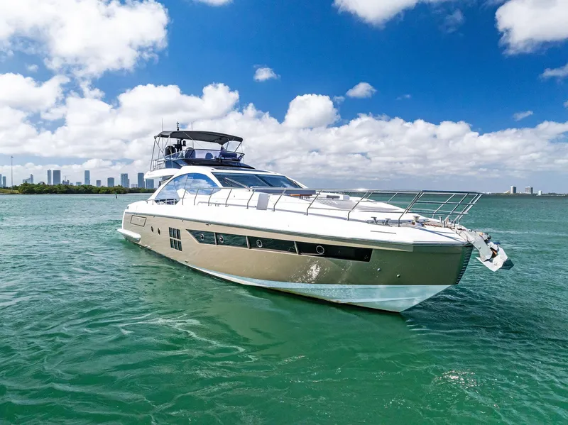 Slide: The Image of 2017 Azimut 77S yacht cruising on clear blue waters under a sunny sky. - 43
