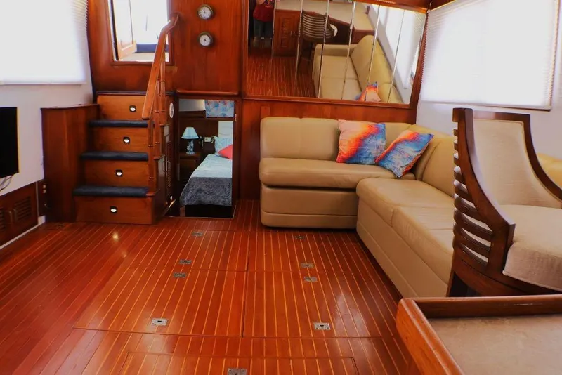 Slide: The Image of Luxurious interior of 1988 Sea Ranger 46 Sundeck Trawler with wooden flooring and cozy seating. - 11