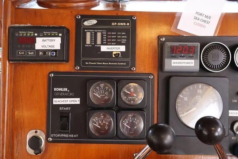 Slide: The Image of Control panel of a 1988 Sea Ranger 46 Sundeck Trawler with gauges and switches. - 15