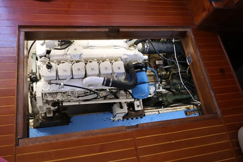 Slide: The Image of Engine compartment of 1988 Sea Ranger 46 Sundeck Trawler with visible machinery. - 25