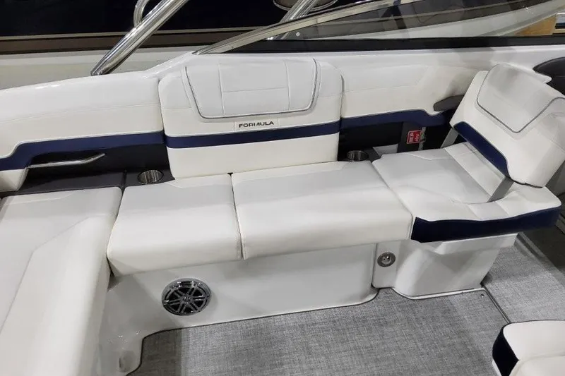 Slide: The Image of 2026 Formula 270 Bowrider interior with white seating and modern design. - 13