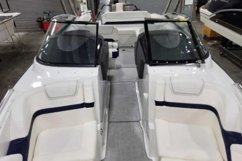 Slide: The Image of 2026 Formula 270 Bowrider boat interior with white seating and dual windshields. - 20