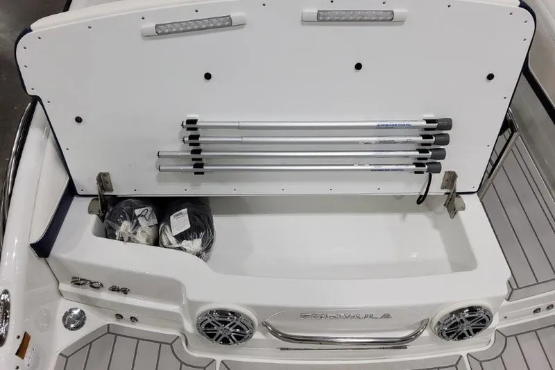 Slide: The Image of 2026 Formula 270 Bowrider storage compartment with poles and accessories. - 24