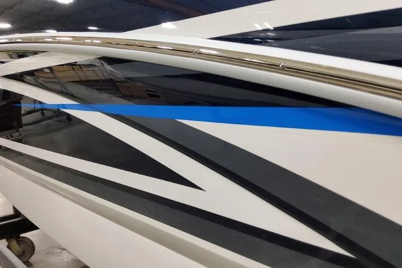 Slide: The Image of 2026 Formula 270 Bowrider boat with sleek, modern design and blue accent stripe. - 26