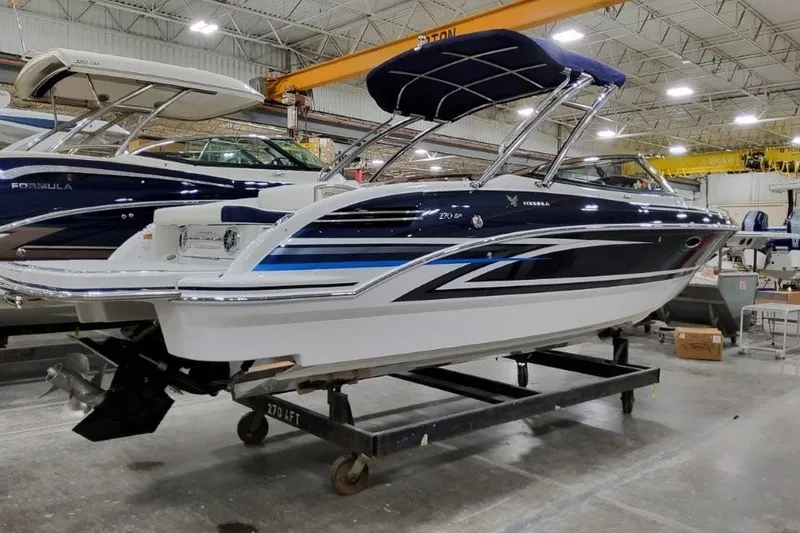 Slide: The Image of 2026 Formula 270 Bowrider boat in a showroom, featuring sleek design and modern features. - 29