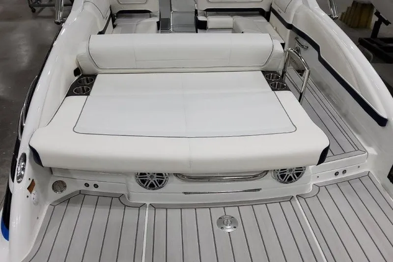 Slide: The Image of 2026 Formula 270 Bowrider boat interior with white seating and cup holders. - 31