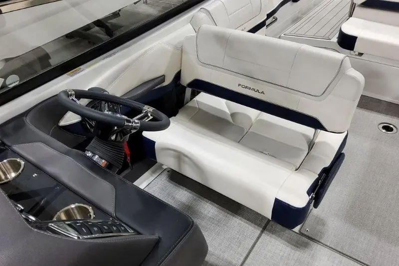 Slide: The Image of 2026 Formula 270 Bowrider interior with steering wheel and seating, showcasing luxury design. - 41