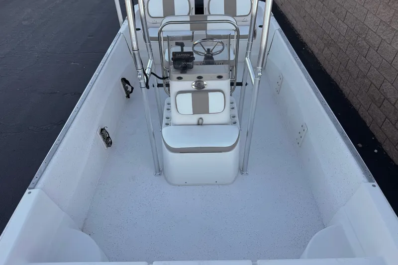 Slide: The Image of 2013 Carolina Skiff 218 boat interior with steering console and seating. - 11