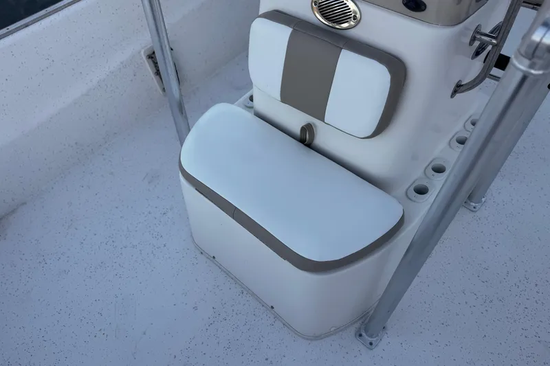 Slide: The Image of 2013 Carolina Skiff 218 boat seat with storage and rod holders. - 12