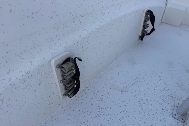 Slide: The Image of 2013 Carolina Skiff 218 boat interior with mounted components and textured surface. - 16