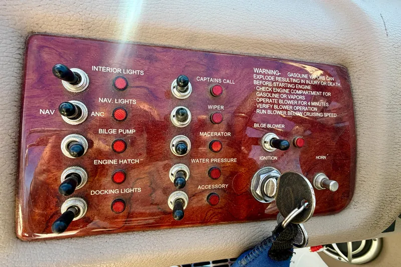 Slide: The Image of 2008 Cobalt 282 boat dashboard with steering wheel and control panel. - 13