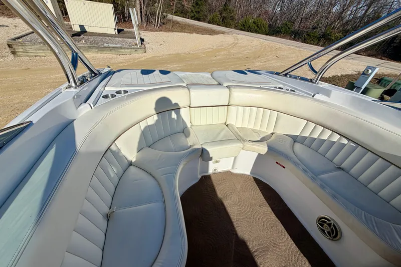 Slide: The Image of 2008 Cobalt 282 boat interior with white leather seating and cup holders. - 21