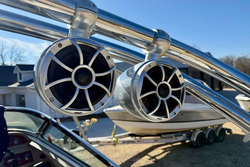 Slide: The Image of 2008 Cobalt 282 boat interior with white seating and open storage compartments. - 26