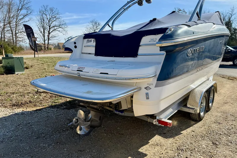 Slide: The Image of 2008 Cobalt 282 boat on trailer, rear view with swim platform, parked outdoors. - 3