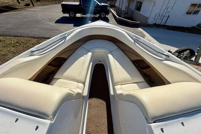 Slide: The Image of 2008 Cobalt 282 boat stern with propeller and trailer on gravel surface. - 6