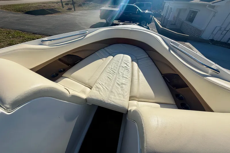 Slide: The Image of 2008 Cobalt 282 boat interior with beige leather seating and brown accents. - 9