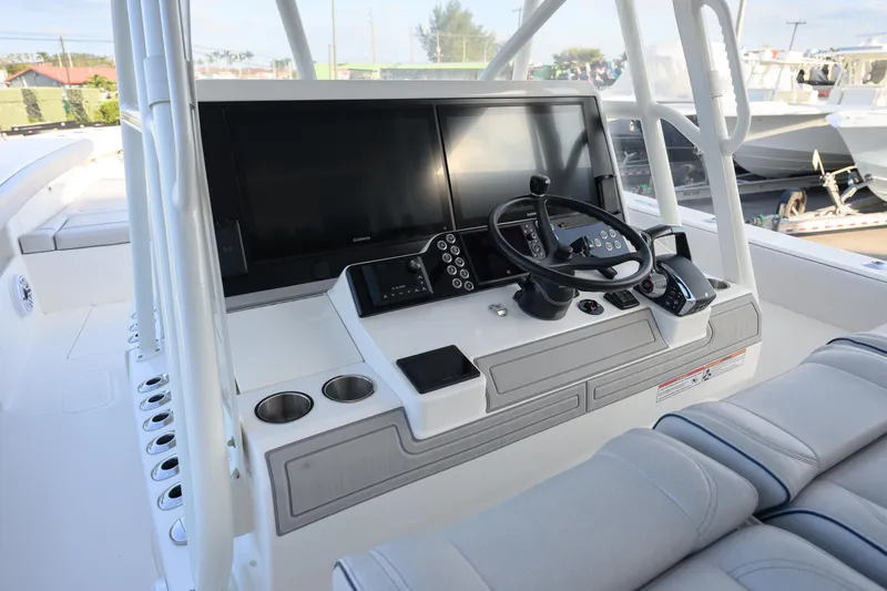 Slide: The Image of 2025 SeaVee 400Z boat dashboard with modern controls and navigation screens. - 1