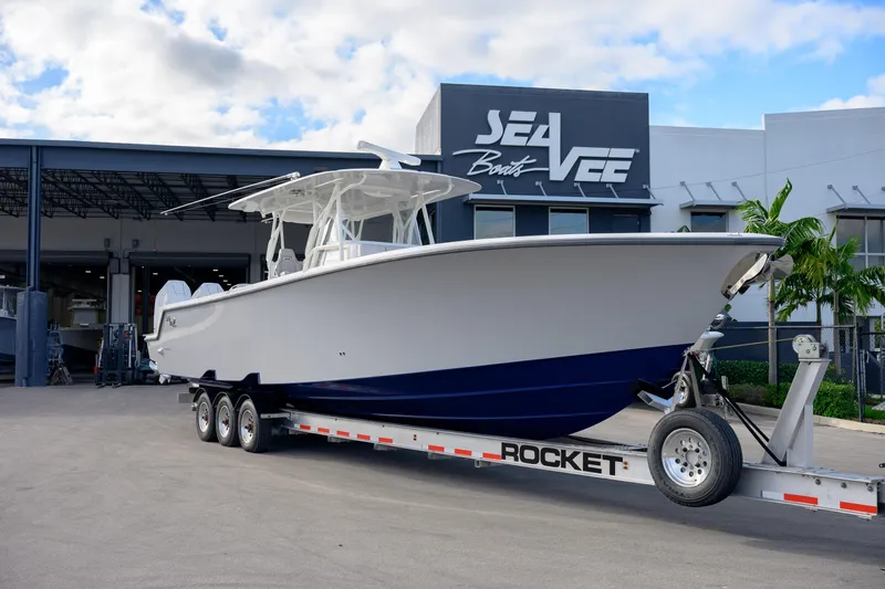 Slide: The Image of 2025 SeaVee 400Z boat with four powerful outboard engines on a trailer. - 11