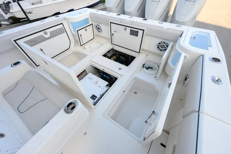 Slide: The Image of 2025 SeaVee 400Z boat interior with three luxury seats and modern steering console. - 13