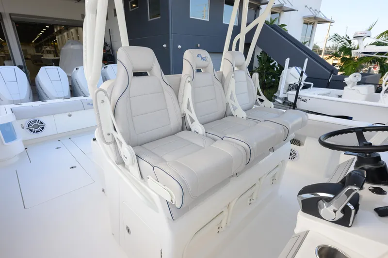 Slide: The Image of 2025 SeaVee 400Z boat with multiple engines on a trailer outside SeaVee Boats facility. - 14