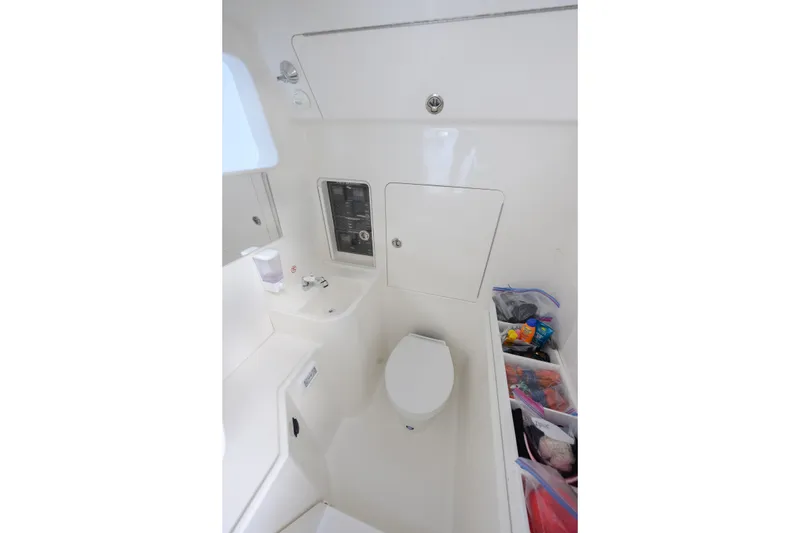 Slide: The Image of 2025 SeaVee 400Z boat deck with open storage compartments and speakers. - 16