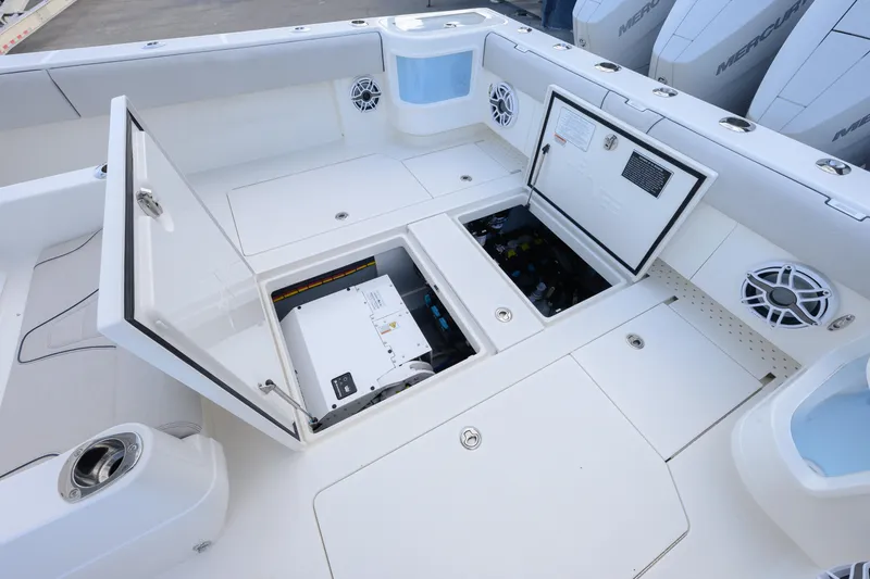 Slide: The Image of 2025 SeaVee 400Z boat interior with cushioned seating and storage compartment. - 17