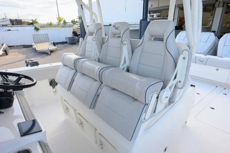 Slide: The Image of 2025 SeaVee 400Z boat interior with luxurious seating and steering wheel. - 2