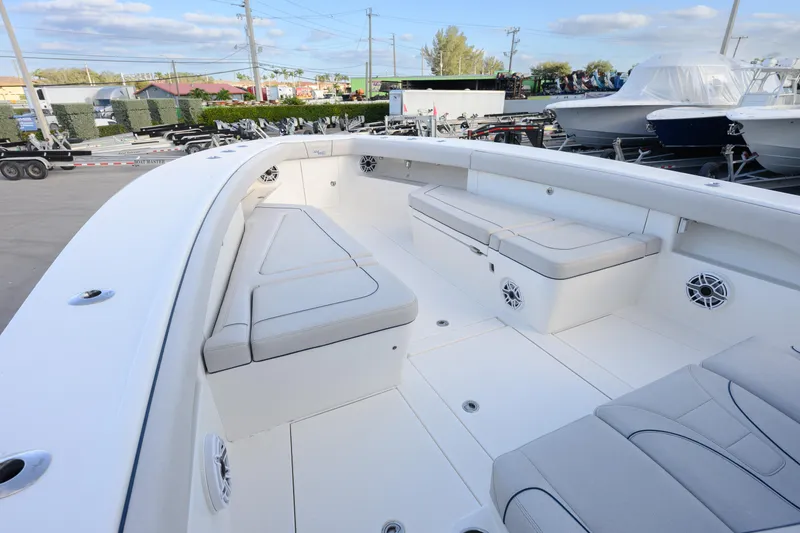 Slide: The Image of 2025 SeaVee 400Z boat interior with cushioned seating and speakers. - 3