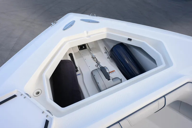 Slide: The Image of 2025 SeaVee 400Z boat anchor compartment with fenders and winch. - 5