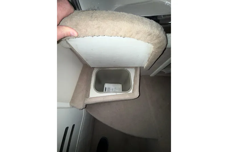 Slide: The Image of Interior of 2000 Sea Ray 240 Sundancer boat with kitchenette and storage. - 16