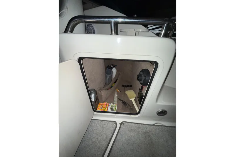 Slide: The Image of Interior view of 2000 Sea Ray 240 Sundancer boat dashboard and steering wheel. - 23
