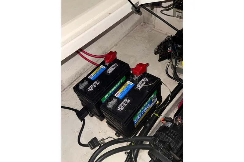 Slide: The Image of Engine compartment of 2000 Sea Ray 240 Sundancer boat, showcasing engine and wiring. - 6