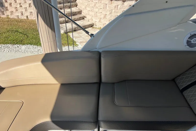 Slide: The Image of 2018 Sea Ray Sundancer 280 interior seating with beige upholstery and modern design. - 10