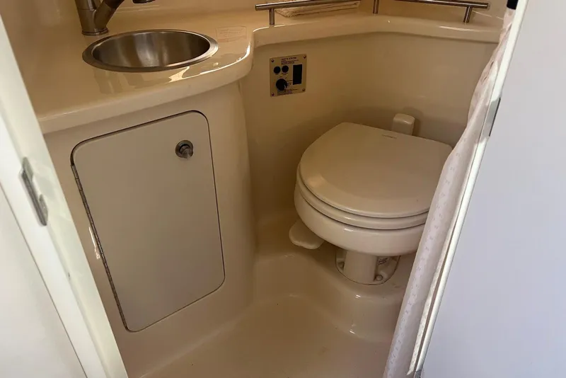Slide: The Image of 2018 Sea Ray Sundancer 280 bathroom with sink and toilet. - 21