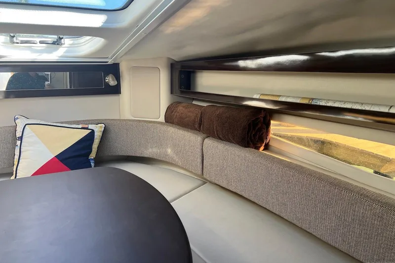 Slide: The Image of Interior of 2018 Sea Ray Sundancer 280, featuring cozy seating and modern design. - 23