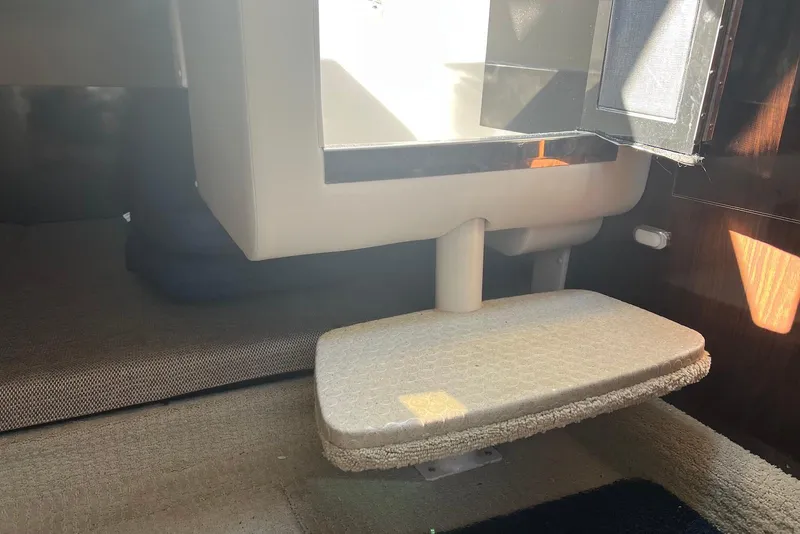 Slide: The Image of Interior of 2018 Sea Ray Sundancer 280, featuring a compact cabin space. - 26