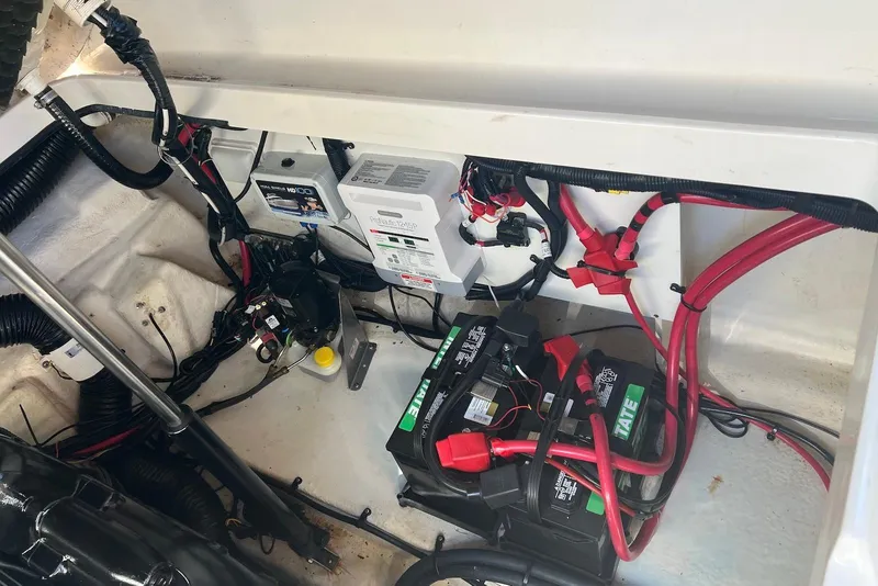 Slide: The Image of 2018 Sea Ray Sundancer 280 engine compartment with batteries and wiring. - 30