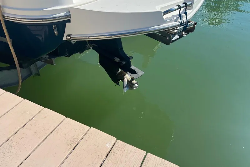 Slide: The Image of 2018 Sea Ray Sundancer 280 boat stern and propeller near dock. - 4