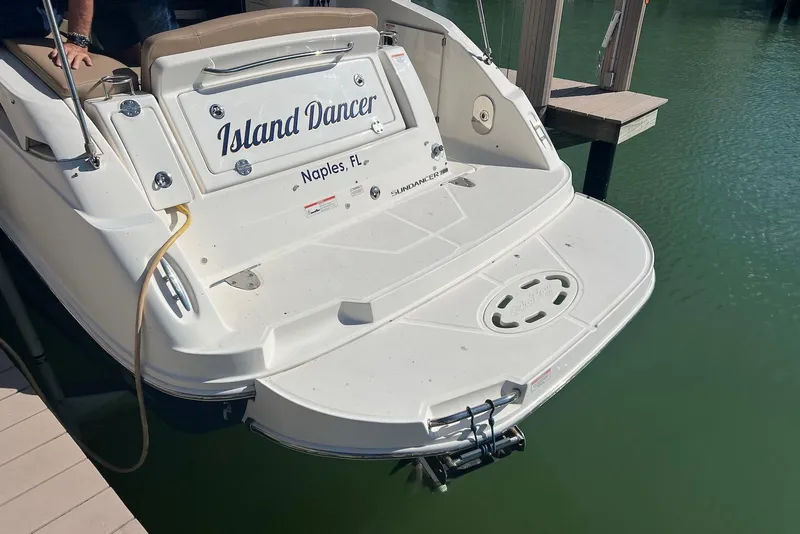 Slide: The Image of 2018 Sea Ray Sundancer 280 boat docked, named "Island Dancer," in Naples, FL. - 8