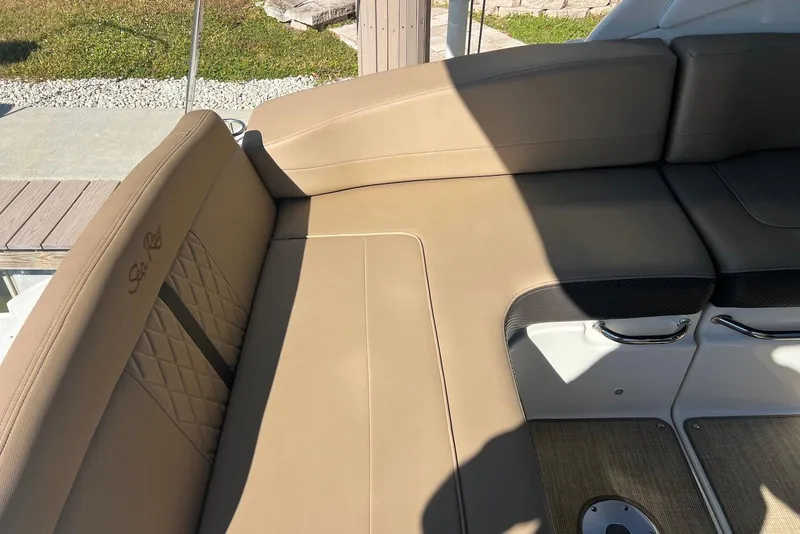 Slide: The Image of 2018 Sea Ray Sundancer 280 boat interior with tan seating and elegant design. - 9