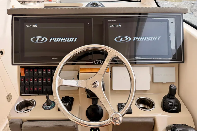 Slide: The Image of 2018 Pursuit DC 365 Dual Console helm with Garmin displays and controls. - 15