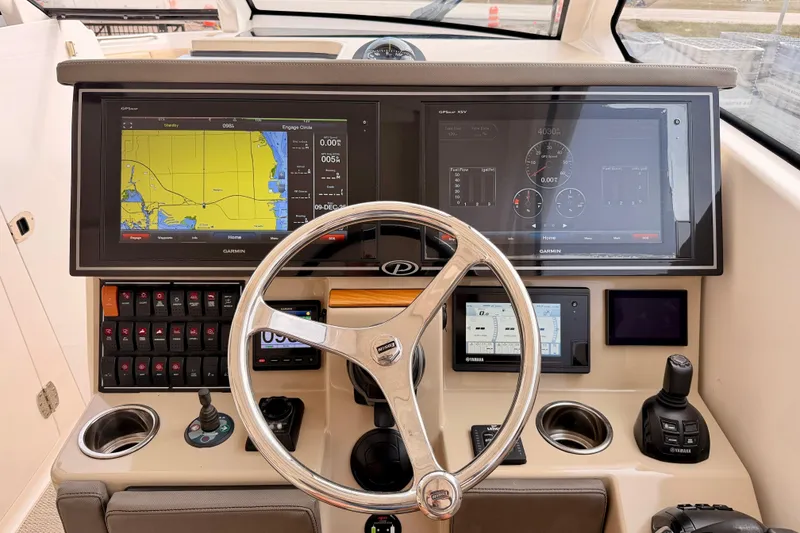 Slide: The Image of 2018 Pursuit DC 365 Dual Console helm with Garmin navigation and control systems. - 16