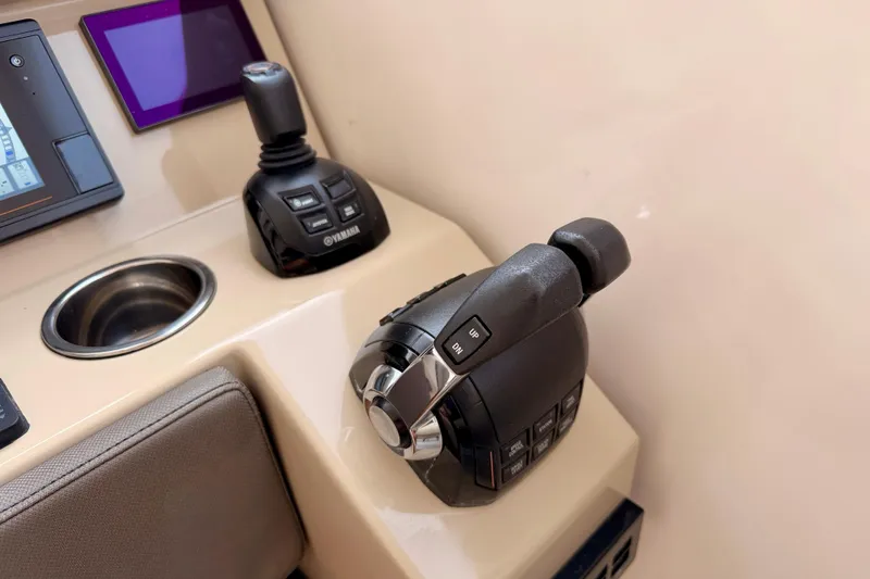 Slide: The Image of Control panel of 2018 Pursuit DC 365 Dual Console boat with Yamaha joystick and throttle. - 19